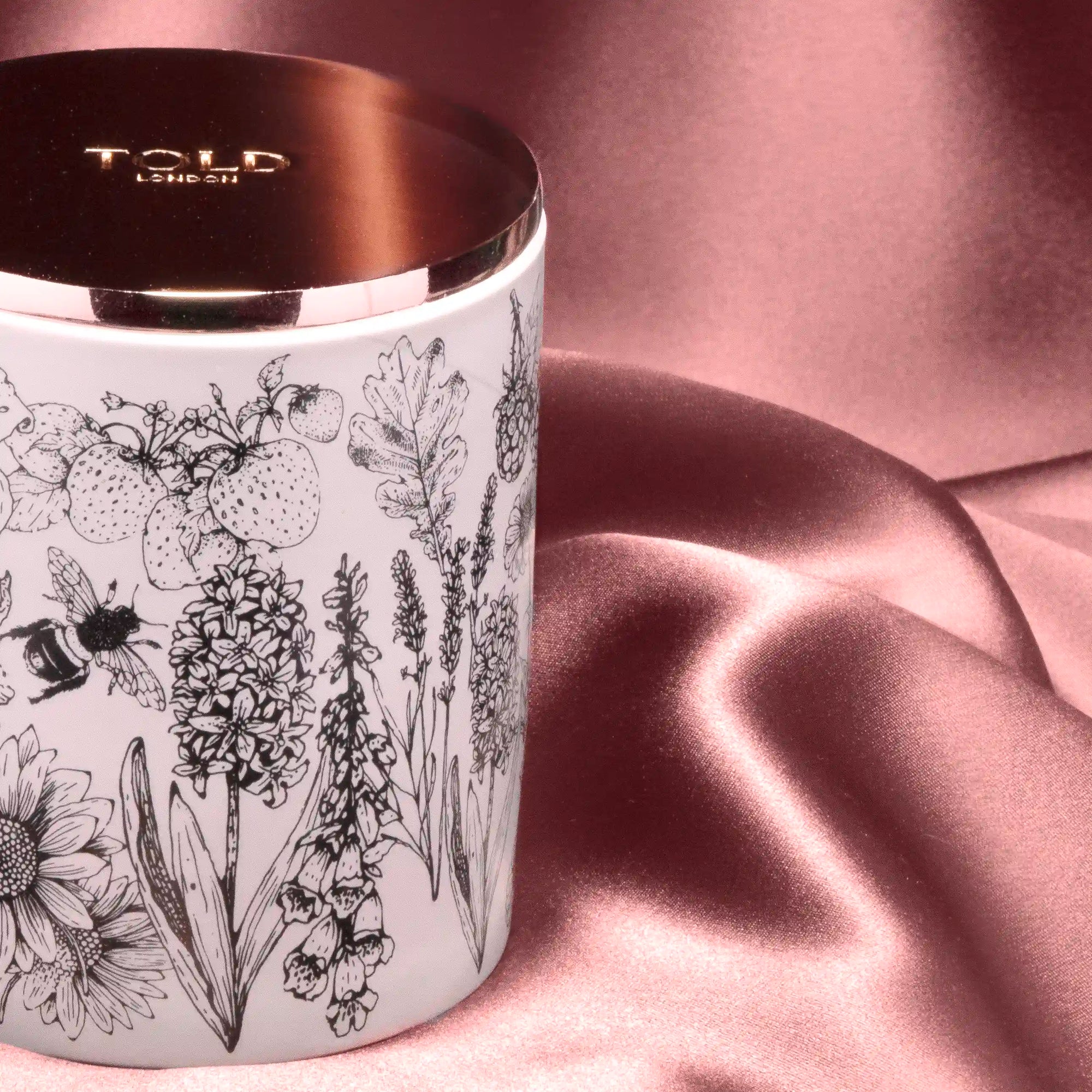 Close up of Glorious Gardens, England 300g Candle on pink silk
